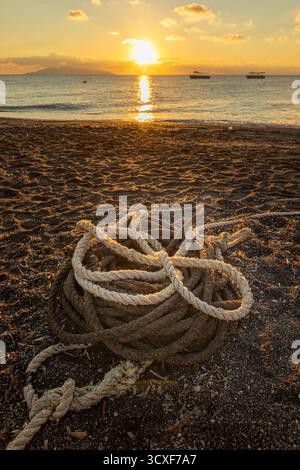 old rope on Kamari beach in the sunrise Stock Photo