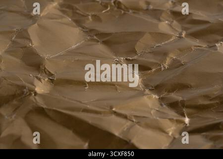 Close up texture of crumpled gold paper for background Stock Photo