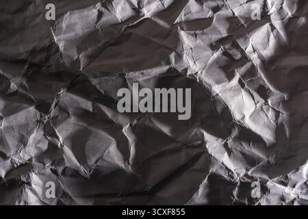Grey crumpled paper texture. Abstract background and texture for design Stock Photo