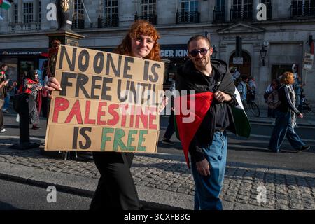 National Demonstration for Palestine, London. Protesters with placard "No one is free until Palestine is free". Stock Photo
