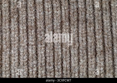Detailed close-up of brown knit wool fabric with a vertical ribbed pattern Stock Photo
