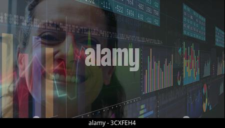 Smiling professional woman analyzing financial data on digital dashboard in workspace, copy space Stock Photo