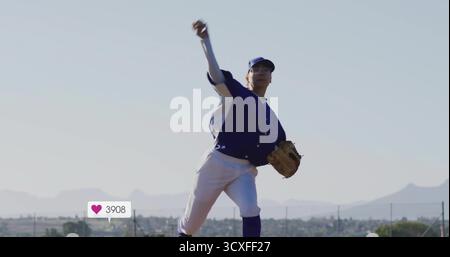 Pitching lone baseball player releasing baseball on field under clear sky, with leather glove Stock Photo