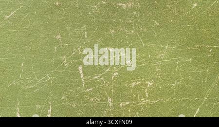 Green old paper surface showing distressed worn out texture with white scratches Stock Photo