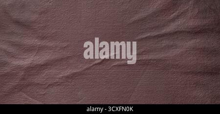 Wrinkled brown fabric forms an abstract background pattern with intricate texture Stock Photo