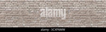 Old brown brick wall presenting a textured pattern for backgrounds Stock Photo