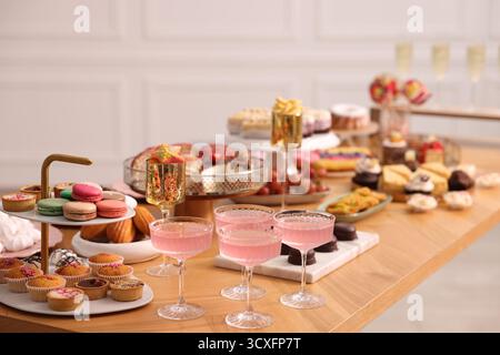 Buffet menu. Delicious desserts and drinks on table, selective focus Stock Photo