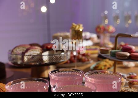 Buffet menu. Delicious desserts and drinks on table, selective focus Stock Photo