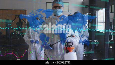 Operating female laboratory technician spraying disinfectant in lab, with data overlay Stock Photo