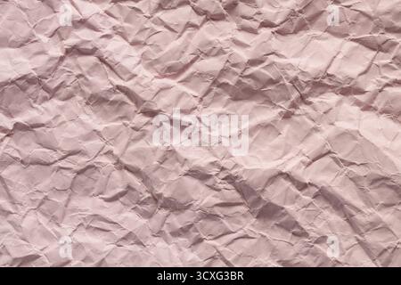 Textured Pink Crumpled Paper Background with Wrinkles and Folds Stock Photo