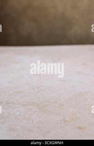 beige table texture and brown wall background Stock Photo