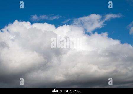 A blue sky with fluffy clouds. A blue sky frame Stock Photo