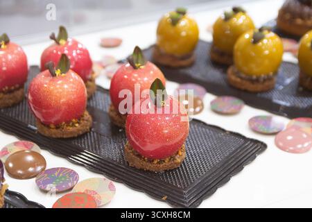 Apple-shaped glaze mousse cake, dessert. Food Stock Photo