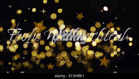 Frohe Weihnachten! text image over golden bokeh lights and stars Stock Photo