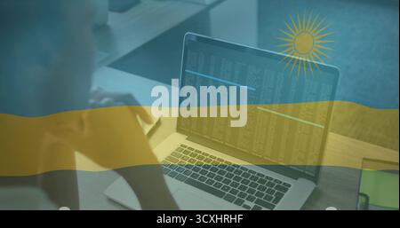 Leaning woman reading code on laptop at office cubicle desk, with smartphone, partition, copy space Stock Photo