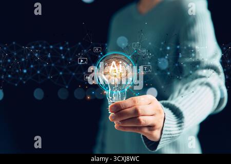 Businesswoman embraces the AI creative innovation concept, with a light bulb symbolizing artificial intelligence powering the modern digital generatio Stock Photo