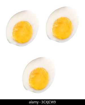 Top view set of unpeeled cooked or boiled chicken eggs in three halves with egg yolks is isolated on white background with clipping path. Stock Photo