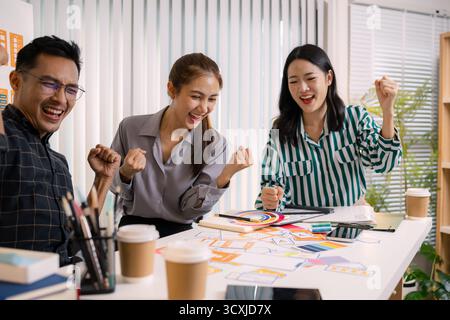 UX/UI designers collaborating during a creative workshop to test interface ideas and exchange feedback for app development, emphasizing teamwork and i Stock Photo