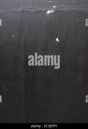 Vertical black poster with crease lines texture, which are imperfections when doing a wheatpaste street poster. Stock Photo