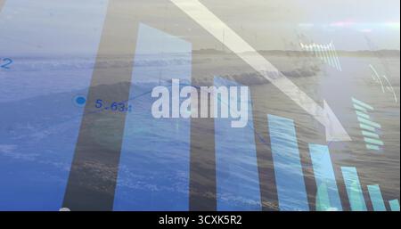 Displaying bar chart, line graph trending downward over ocean waves, showing white arrow and values Stock Photo