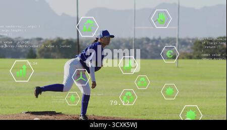 Female athlete in blue uniform releasing pitch on mound at grass field, with glove, data overlays Stock Photo