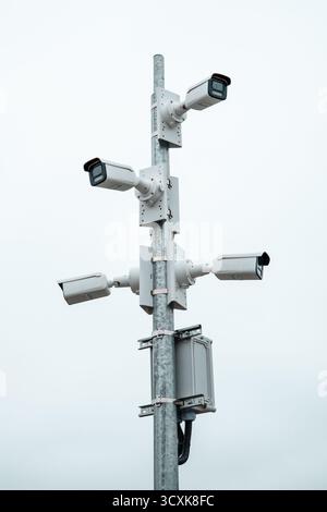 Lots of CCTV cameras on a high pole Stock Photo