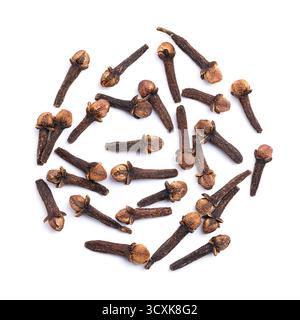 Dried cloves on white background. Bunch of aromatic flower buds of the tree Syzygium aromaticum, used as spice, flavoring, or fragrance. Stock Photo