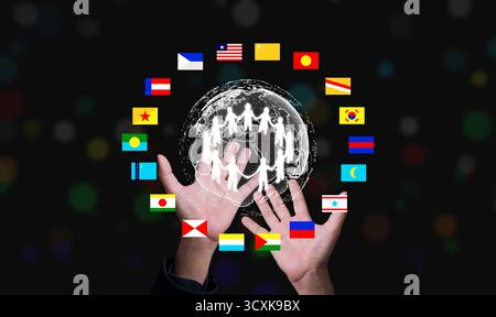 Concept of world unity and digital collaboration showing people around glowing Earth with diverse flags, representing international partnership and gl Stock Photo