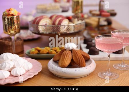 Buffet menu. Delicious desserts and drinks on table, selective focus Stock Photo