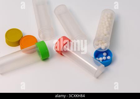Homeopathic pills in plastic bottles on a white background Stock Photo