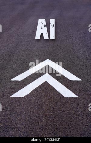 AI concept. Artificial intelligence. Word written on the asphalt above the symbol of upward or forward-pointing arrows. Stock Photo