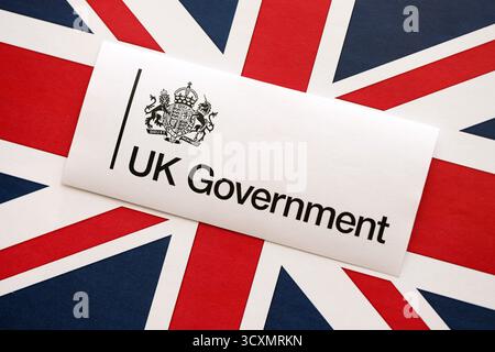 KYIV, UKRAINE - SEPTEMBER 17, 2025 Government GOV UK logotype sticker lies on UK flag close up Stock Photo