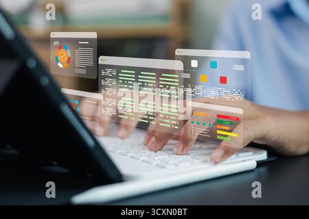 Software developer typing on laptop with virtual data dashboard and coding interface, concept of programming, data analysis, and digital technology in Stock Photo