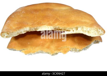 two halves of Traditional Shami flat bread with wheat and flour, small Aish Shamy or small pita bread baked in extremely hot ovens, it is the result o Stock Photo