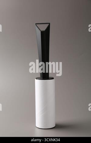 One sticky lint roller on grey background Stock Photo
