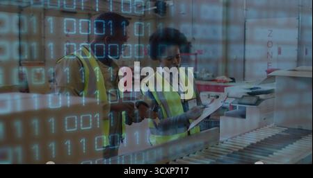 Workers in vests scanning boxes on conveyor belt, checking clipboard in warehouse, binary overlay Stock Photo