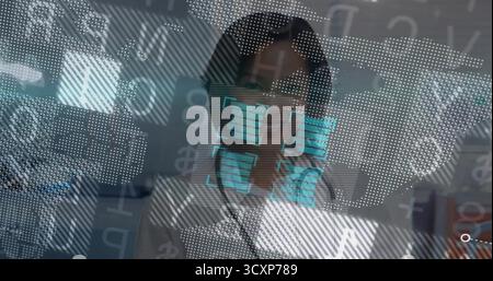 Standing analyst wearing lab coat analyzing holographic interface in data lab, with code panels Stock Photo