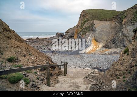 Cliif erosion next to steps at Sandymouth Bay beach Cornwall Stock Photo