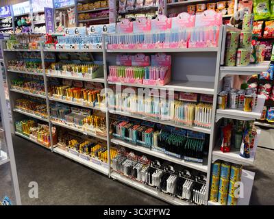 Manchester, UK - September 26, 2025: Vibrant assortment of pens and markers on Kenji shelves inviting creative projects and school use. Stock Photo