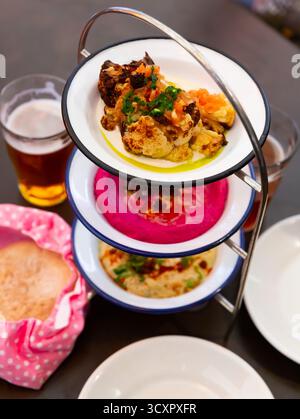 Different types of meze dishes served on table Stock Photo