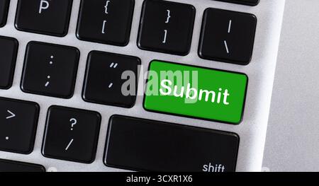 Word Submit on green button of keypad Stock Photo