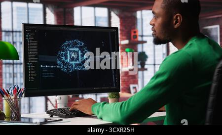 System engineer coding AI brain model of neural network for machine learning, solving tasks on computer. Debugging software algorithm and checking for errors, innovation. Camera A. Stock Photo