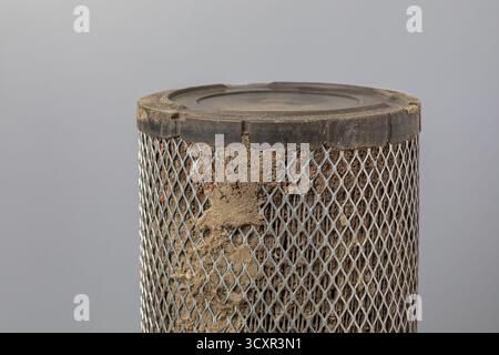 Dirty air filter for cab of farm tractor or combine harvester. Agriculture and farming equipment repair, maintenance and service concept Stock Photo