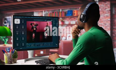 Black graphic designer working in loft with AI image generator software. Digital screen displaying visuals created through machine learning and cloud computing, generative AI. Camera A. Stock Photo