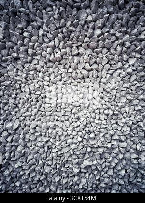 High angle view of closely packed textured stones forming an abstract and uniform pattern Stock Photo