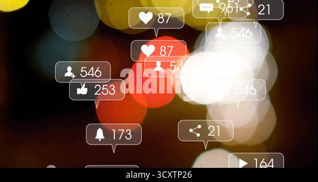 Floating notification bubbles appearing on dark bokeh digital interface, with counters and icons Stock Photo