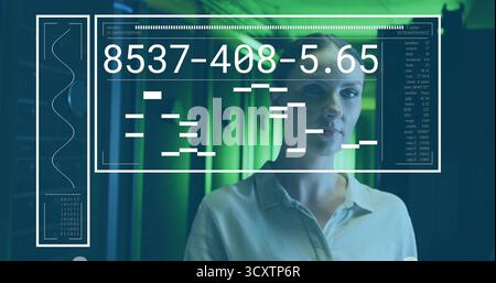 Female technology professional analyzing data on digital interface panel in data center, copy space Stock Photo