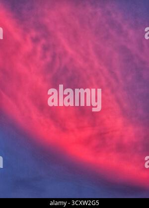 beautiful sunset sky with clouds. dreamy pink clouds at sunset. vibrant pink and purple sunset sky Stock Photo