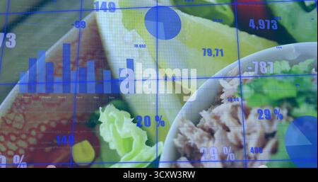 Salad bowl featuring shredded protein greens and lemon under data overlay on tabletop, copy space Stock Photo