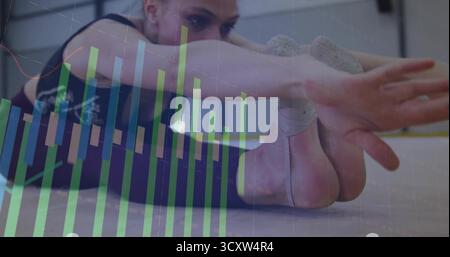 Stretching dancer wearing leggings reaching toward nonslip grips in studio, with bar chart overlay Stock Photo